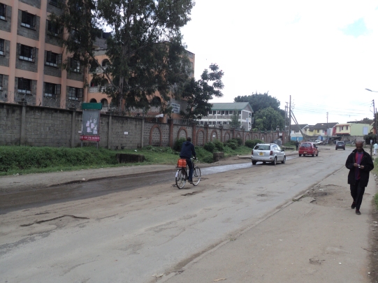 A cyclist is forced to use the centre of the Road in Nairobi, Kenya
